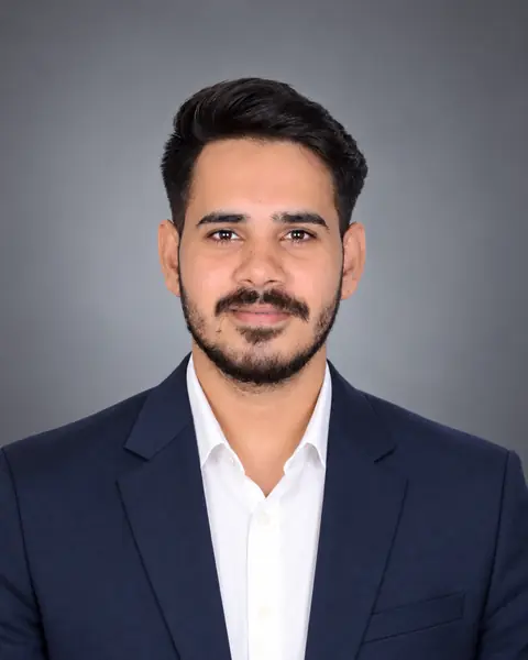 Yatharth, founder of Kinexis Agency, in a navy suit